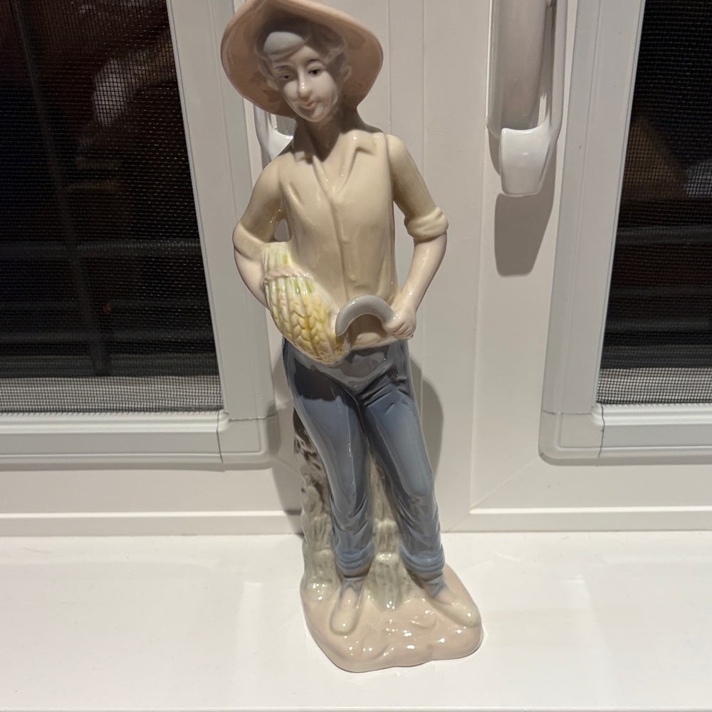 Cream and Blue Porcelain Farmer Figurine